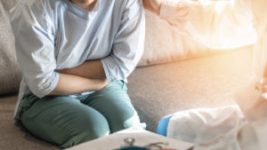 Abdominal Pain Patient Woman Having Medical Exam With Doctor On