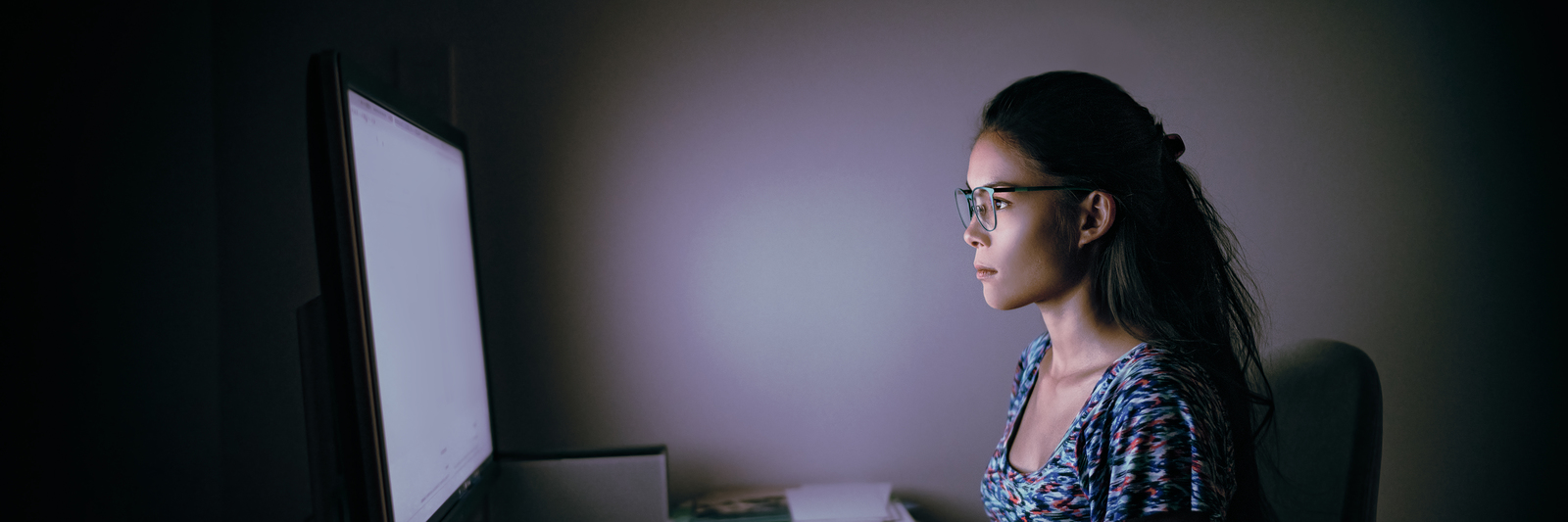 Computer online internet addiction young woman staring at comput